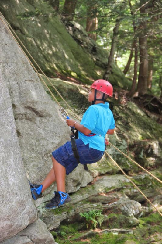 Leadership Training camp participants participate in a rock climbing challenge.