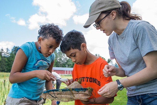 kids examining what was caught in a net